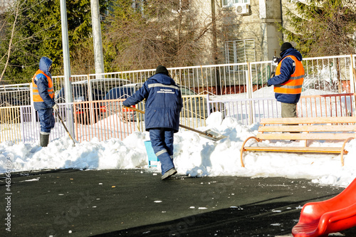 a janitor removes snow from the streets with an icebreaker / immigrant