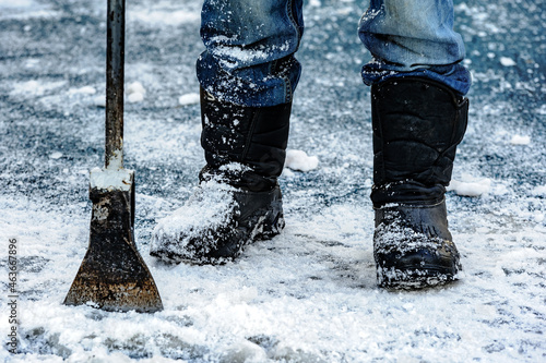 a janitor removes snow from the streets with an icebreaker / immigrant