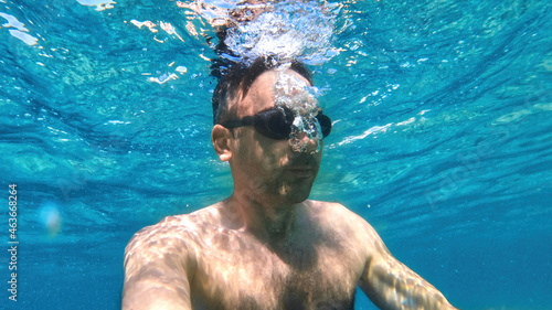 Man swimming under the water, Mediterranean sea