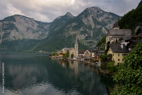 Panoramic view of famous old town Hallstatt and alpine deep blue lake in scenic sunset light on a beautiful day in summer, Salzkammergut, Austria