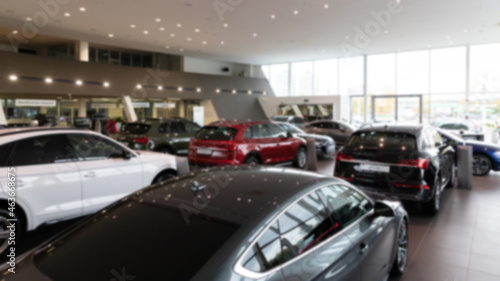 luxury cars in the interior of a car dealership, blur photo