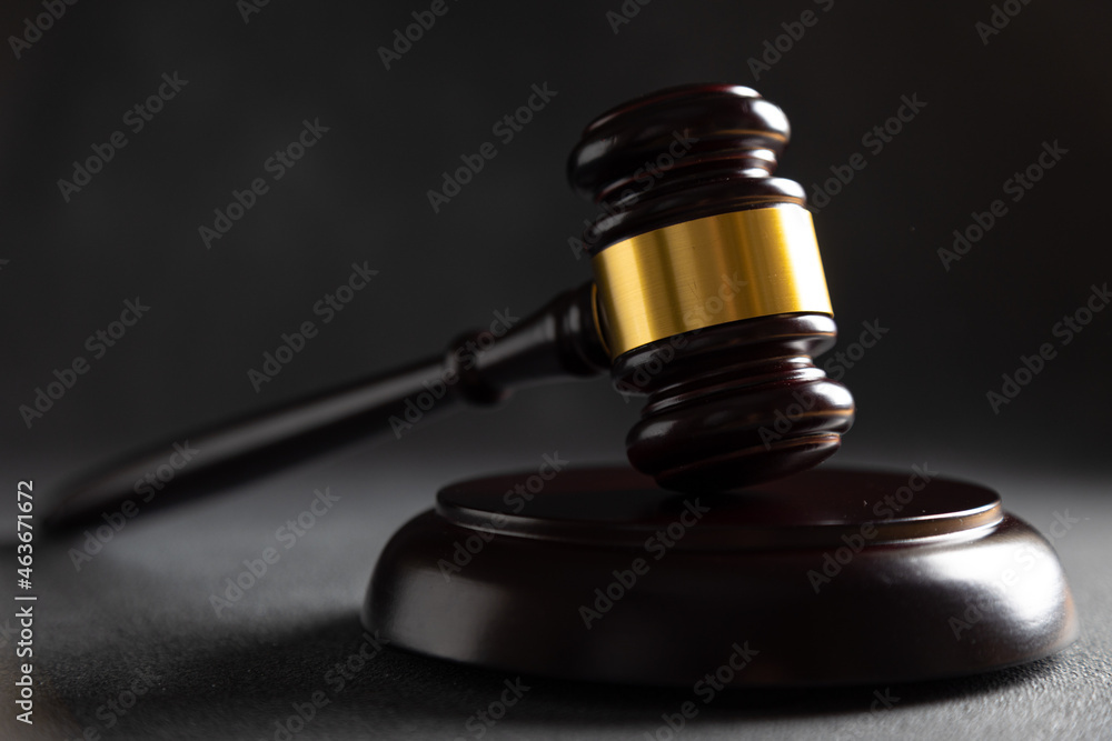 Judge's gavel on dark background, top view. Law concept Judge's gavel on dark background, top view. Law concept