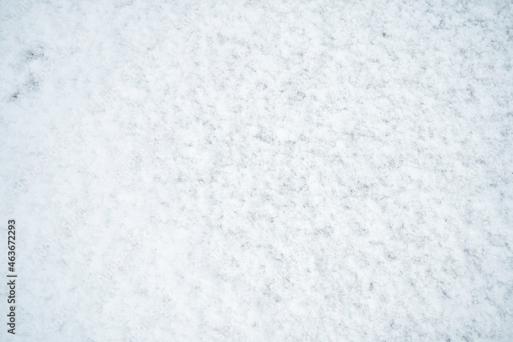 The texture of white untouched snow lying on the road The texture of white untouched snow lying on the road