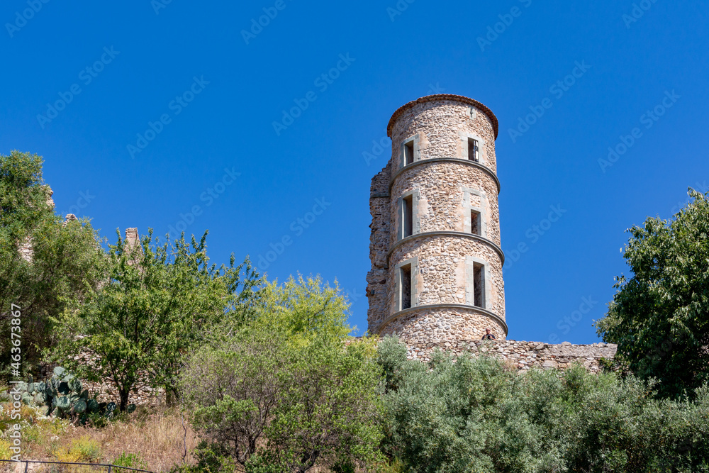 Walking on ancient french village Grimaud, touristic destination with ruines fortress castle on top, Var, Provence, France Walking on ancient french village Grimaud, touristic destination with ruines fortress castle on top, Var, Provence, France