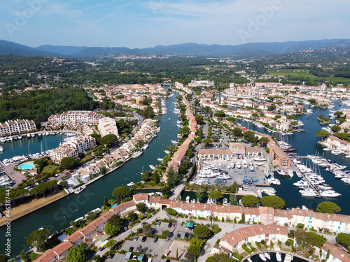 Fototapeta Naklejka Na Ścianę i Meble -  Aerial view on small houses and sailboats of Port Grimaud and port Cogolin, French Riviera, Provence, France