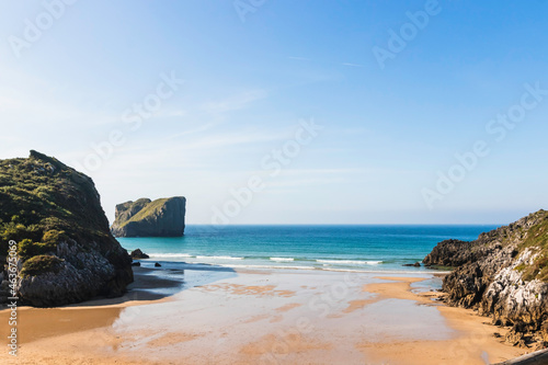 Asturias beach with rocks and green meadows. virgin place without people