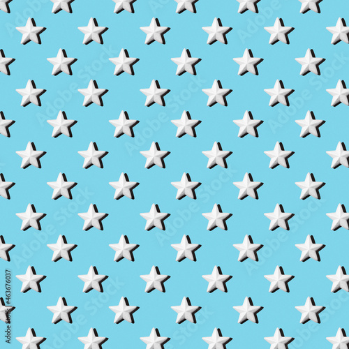 Pattern of white stars on a blue background, flat lay