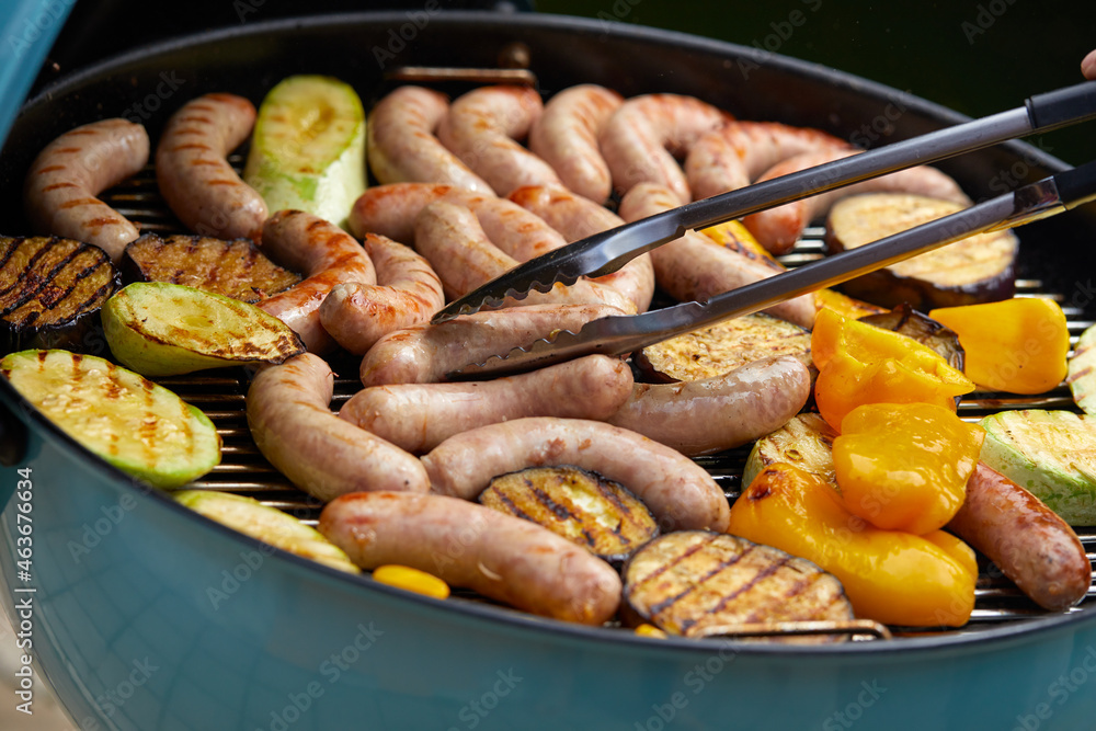 Delicious assortment of meat neck steak and vegetables grilling on a BBQ Delicious assortment of meat neck steak and vegetables grilling on a BBQ
