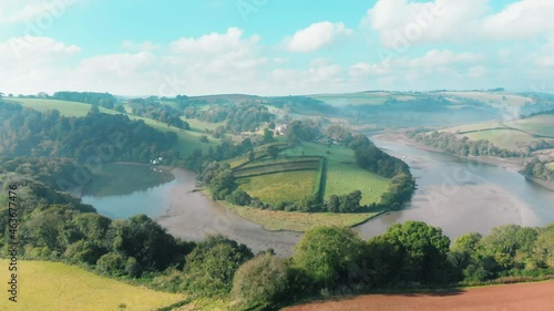 Aerial view of a bend in the river, with mist rising off the water, in Sharpham, Devon, UK photo