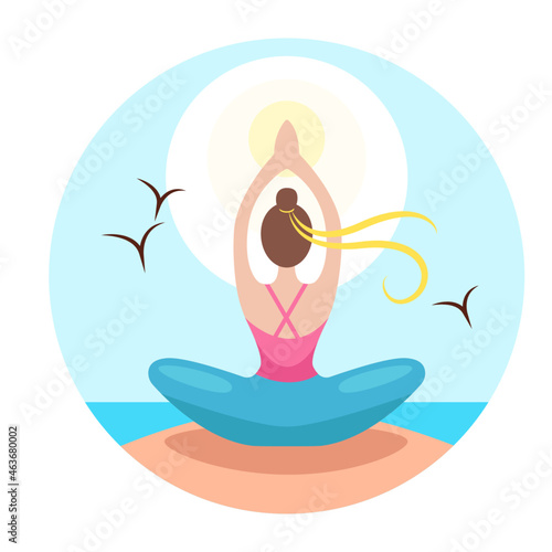 A girl doing yoga on the beach