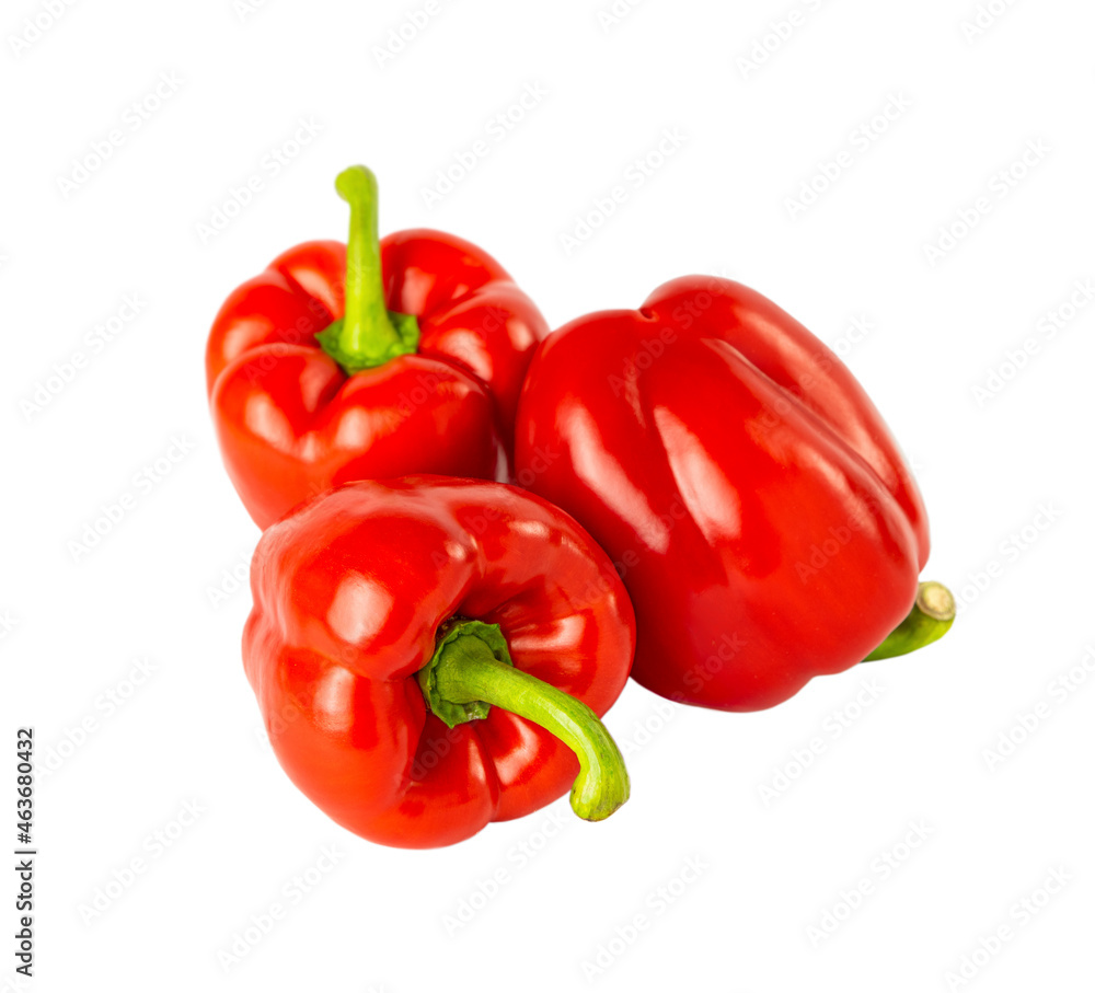 Three red bell peppers isolated on a white background. Three red bell peppers isolated on a white background.