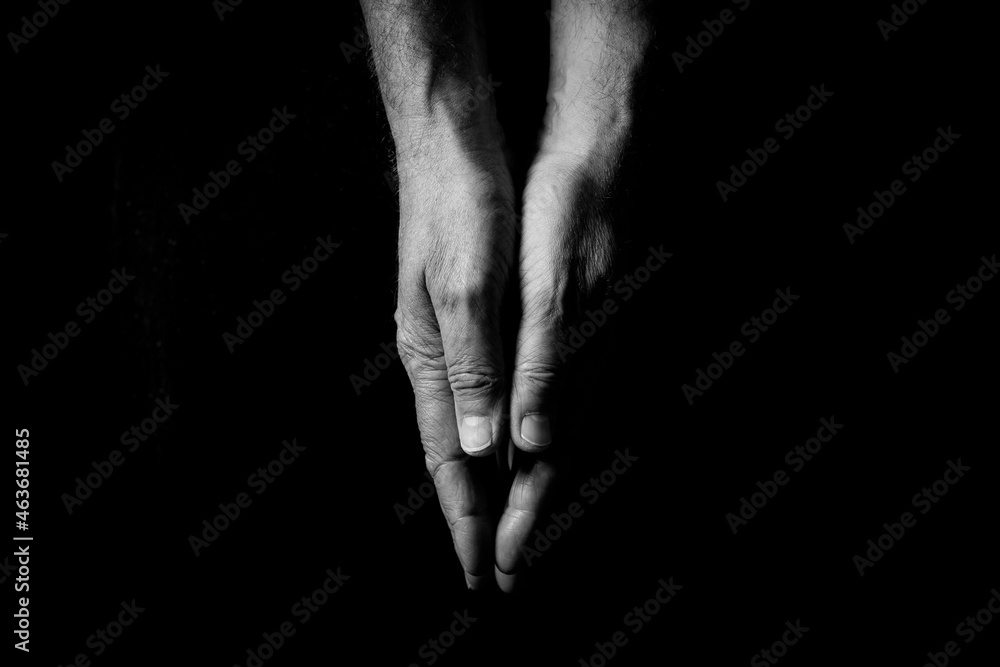 Fototapeta premium Two male hands touching, palms pressed together.