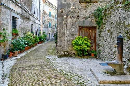 A narrow street of Castro dei Volsci in medieval town of Lazio region, Italy. photo