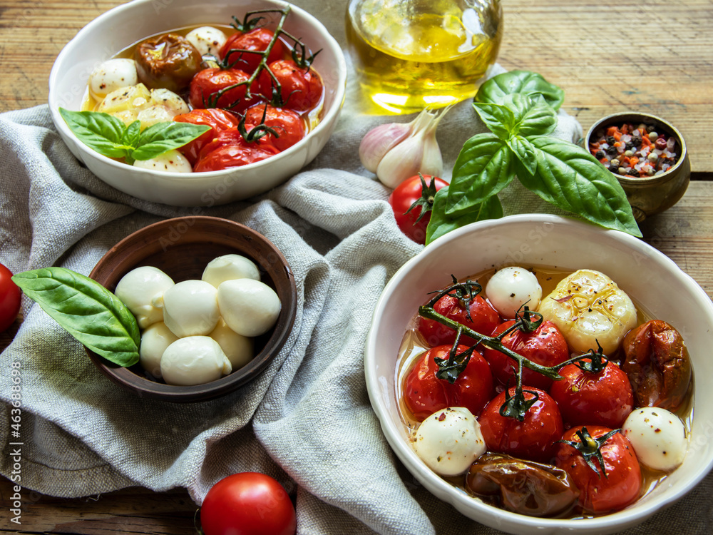 Salad. Baked tomato, basil, garlic with mozzarella cheese, ceramic dishes. cooking, cooked dish