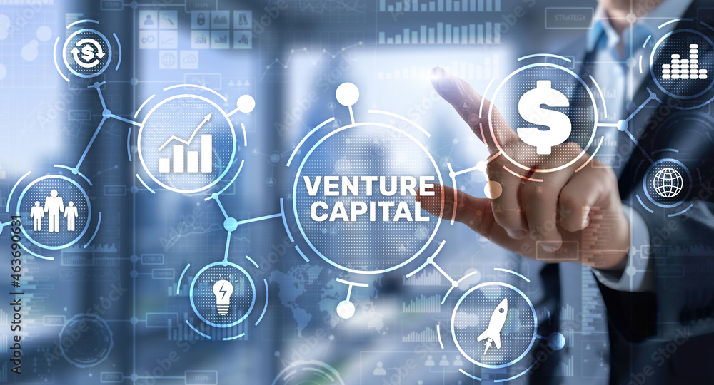 Venture capital. Investor capital. Businessman pressing virtual screen inscription Venture capital. Investor capital. Businessman pressing virtual screen inscription