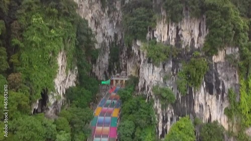 The Batu Caves and the colossal statue of Lord Murugan in Kuala Lumpur, Malaysia. (aerial photography) photo