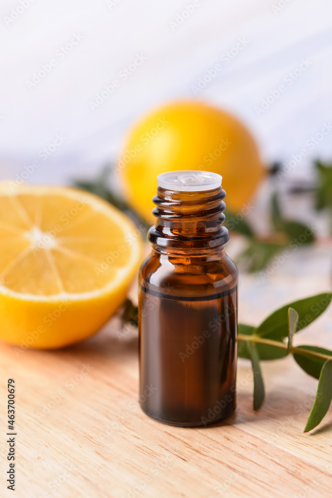 Bottle of essential oil on table, closeup Bottle of essential oil on table, closeup