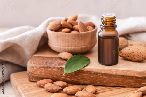 Bottle of almond essential oil on table