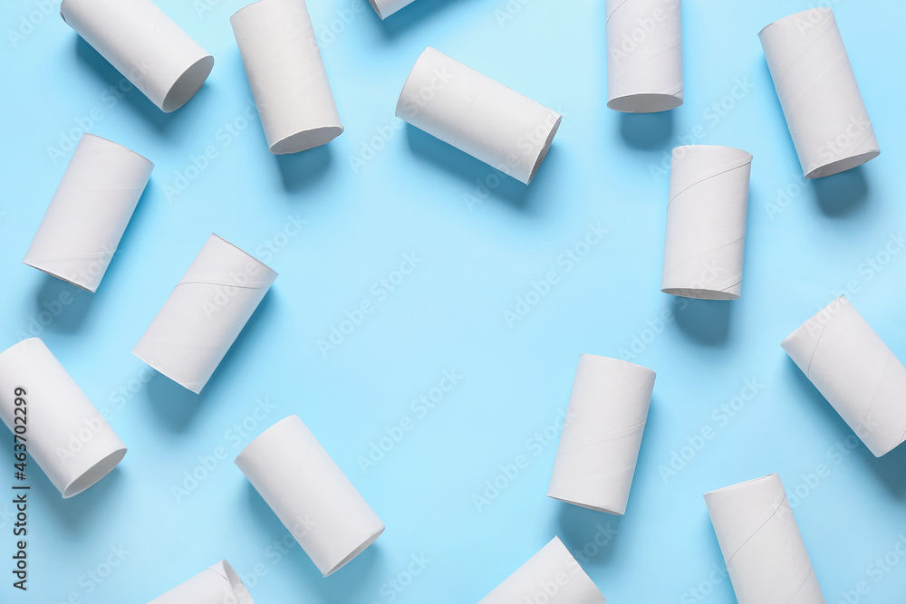 Frame made of toilet paper cardboard tubes on color background Frame made of toilet paper cardboard tubes on color background