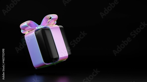 rotating gift box animation with holographic ribbon flying and rotating in studio. Christmas, black friday, birthday 3d gift animation. 4k seamless loop motion video greeting card on black background.