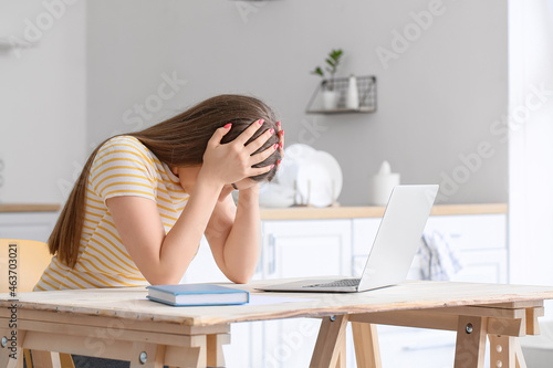 Young woman working with la...