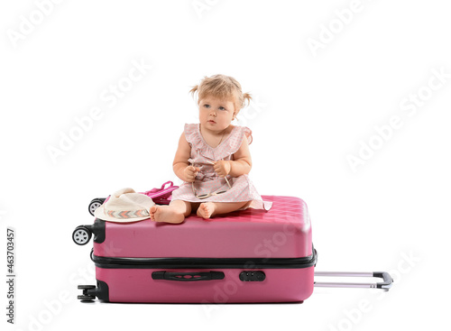 Cute baby girl with suitcas...