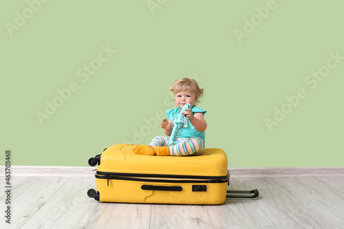 Cute baby girl with toy and...