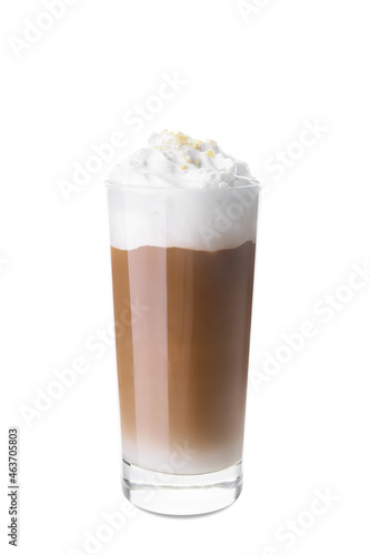 Glass of tasty latte with nuts on white background