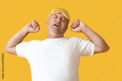 Yawning mature man with sle...