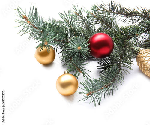 Fir branch with Christmas balls on white background  closeup