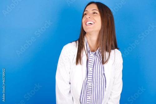 Young european doctor woman on blue background very happy and excited about new plans.