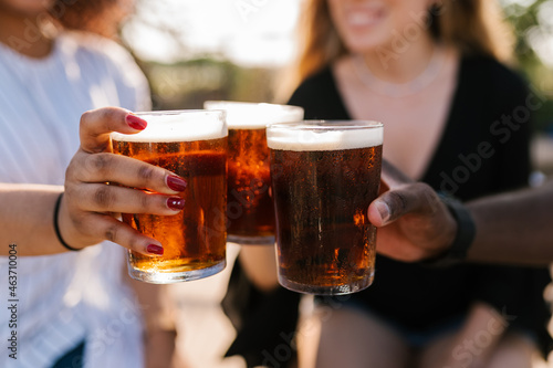 Friends toasting with beer photo