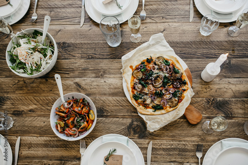 Table with pizza and salad