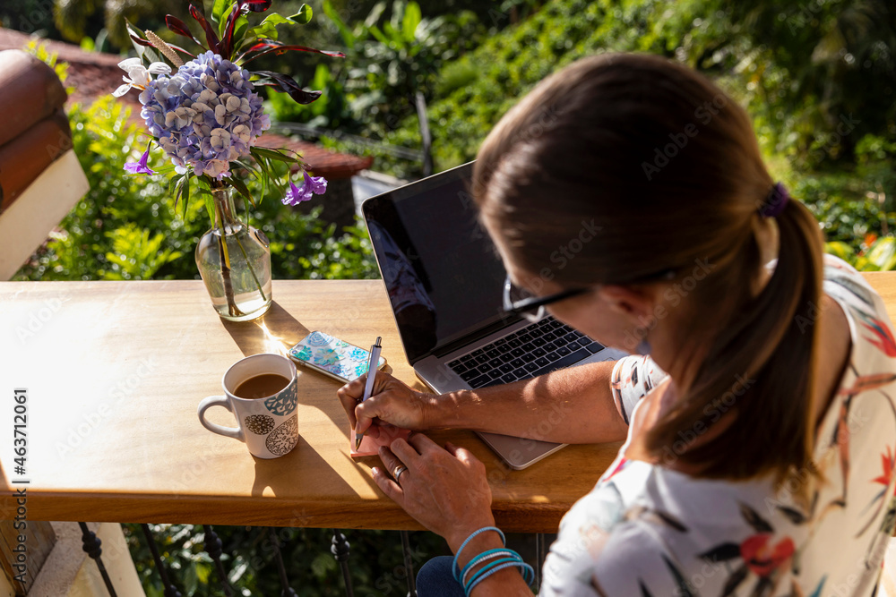 Woman Writing Notes in office 