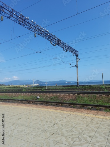 railway track, rails in the distance, road