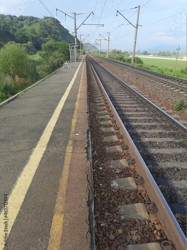railway track, rails in the distance, road