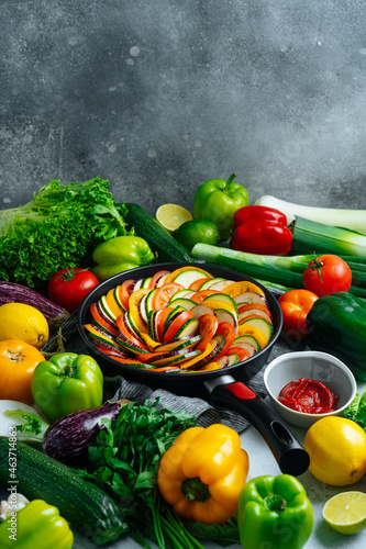 Uncooked ratatouille arranged with vegetables