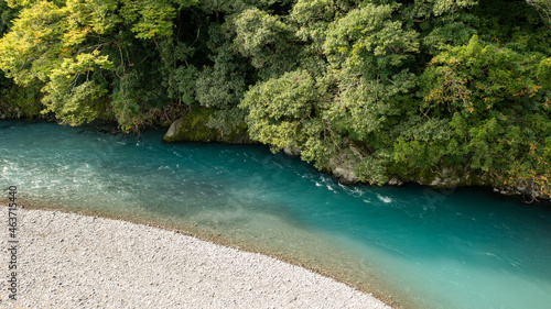 A turquoise river flowing through the mountains