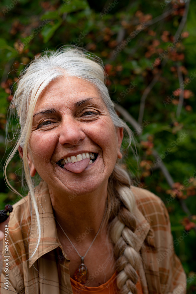 Happy senior woman showing her tongue Happy senior woman showing her tongue