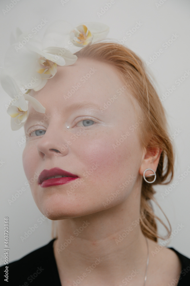 portrait of a redhead model with make up and flowers portrait of a redhead model with make up and flowers