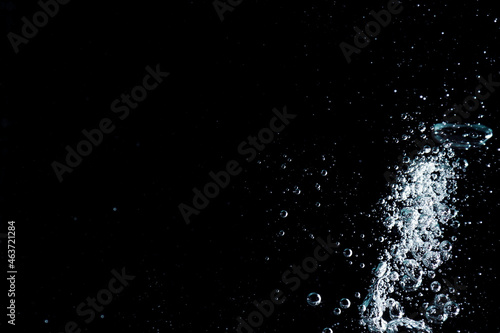 Water bubbles texture on black background © taffpixture