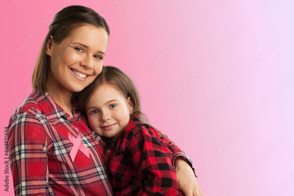 Beautiful loving mother and daughter, hugging each other, symbol of World Breast Cancer Beautiful loving mother and daughter, hugging each other, symbol of World Breast Cancer