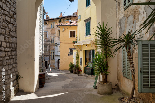 Obraz na płótnie Rijeka, Croatia - August 11, 2021: Resort on the Adriatic Sea. City beaches, vegetation and buildings in Croatia. Seascape with a stone shore. w salonie