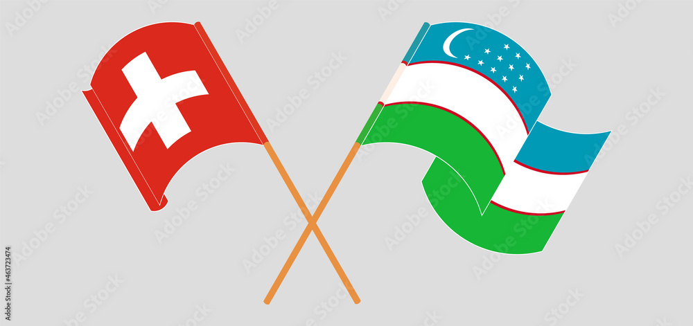 Crossed and waving flags of Switzerland and Uzbekistan
