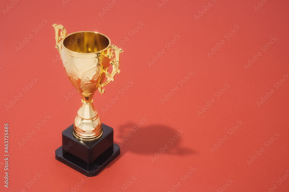 Golden Trophy On Red Background With Copy Space Golden Trophy On Red Background With Copy Space