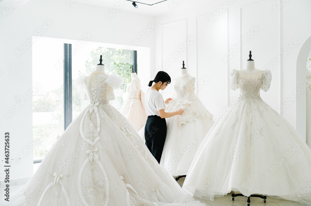 Young woman in wedding dress shop Young woman in wedding dress shop