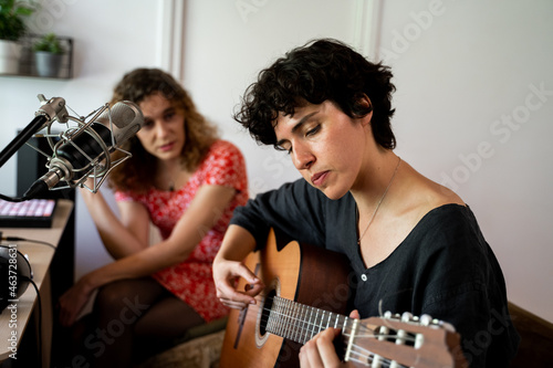 Musician Friends recording music at home studio photo