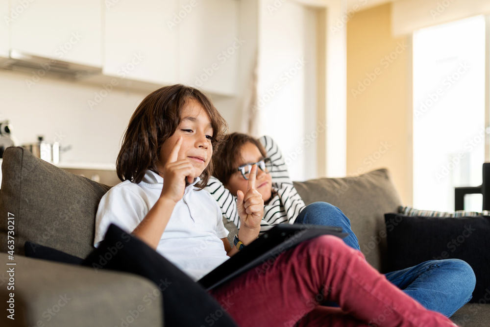 Sibling on the sofa at home Sibling on the sofa at home