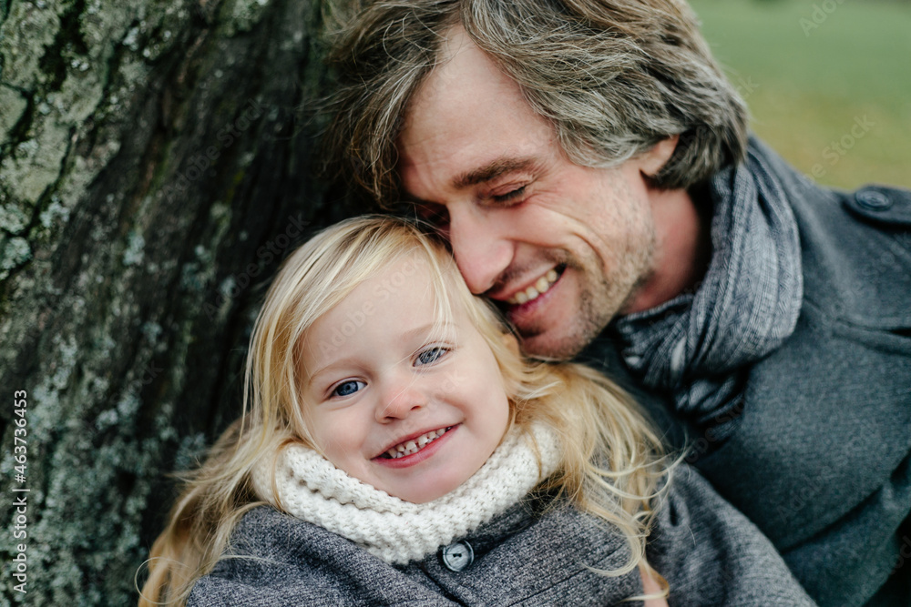 Happy father and daughter in park Happy father and daughter in park