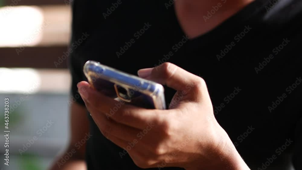 Indonesian young people are using smartphones. for the concept of technology videos, mobile applications, smartphone addiction, and social media chat. Indonesian young people are using smartphones. for the concept of technology videos, mobile applications, smartphone addiction, and social media chat.
